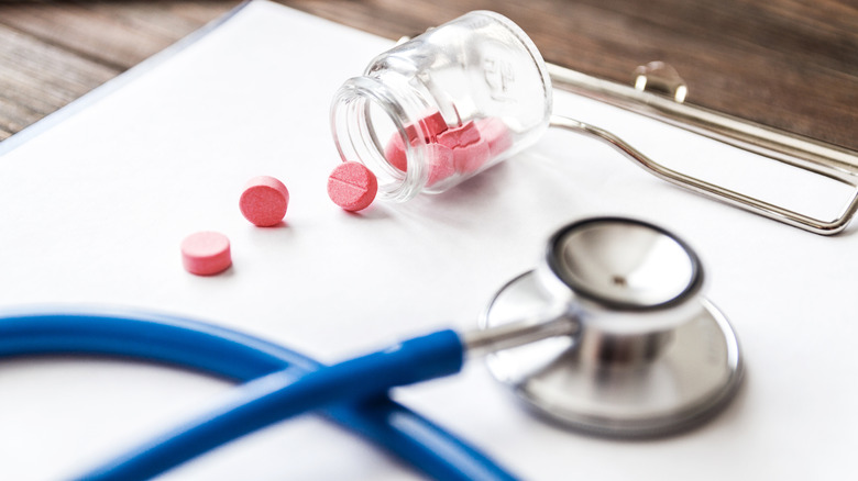 medical chart with pill bottle