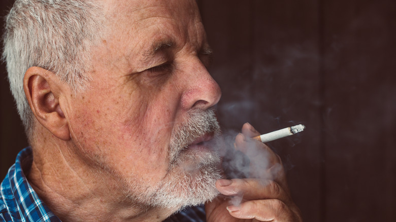 man smoking cigarette