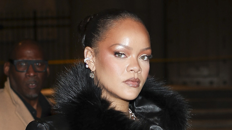 Rihanna looking serious in an image of her outside of a celebrity event
