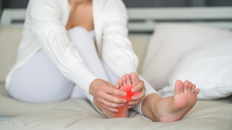 Woman reaching for her foot