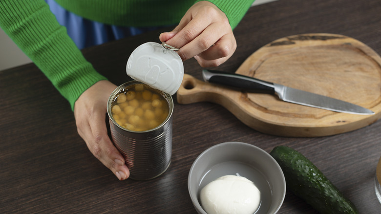 Woman cooking with canned beans