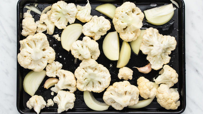 cauliflower onions on baking sheet 