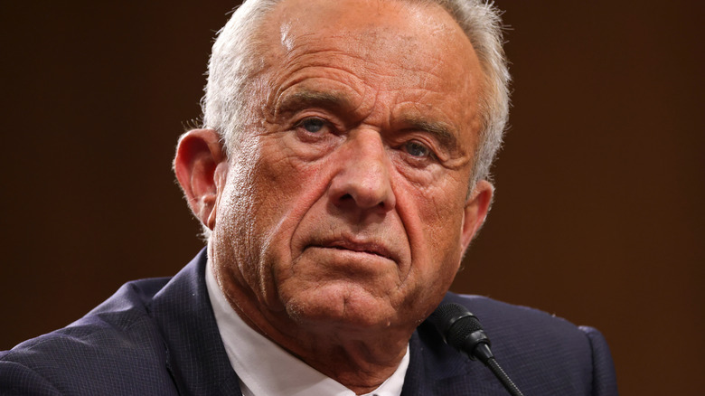 Robert Kennedy Jr. seated in front of microphone