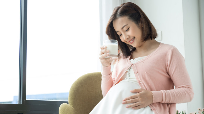 pregnant woman rubbing stomach