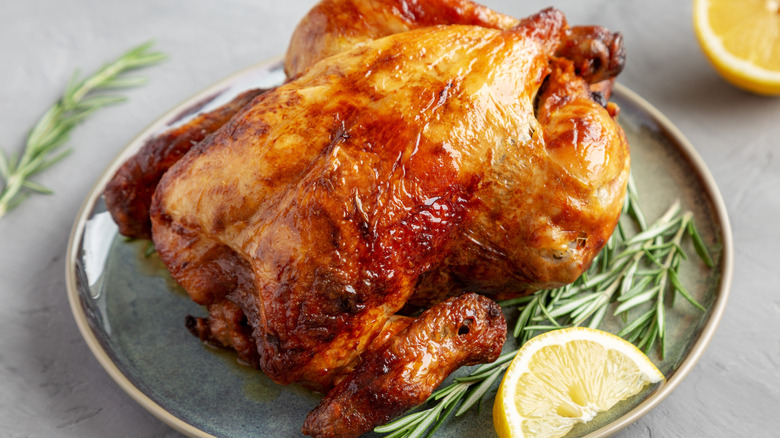 Family enjoying roast chicken dinner