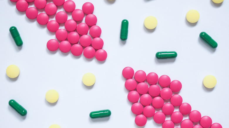 Drug interaction concept with arrows made of pills