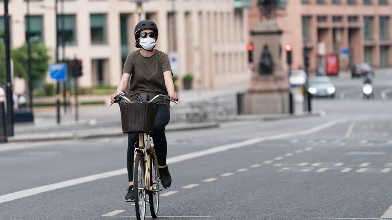 A person bikes in a city