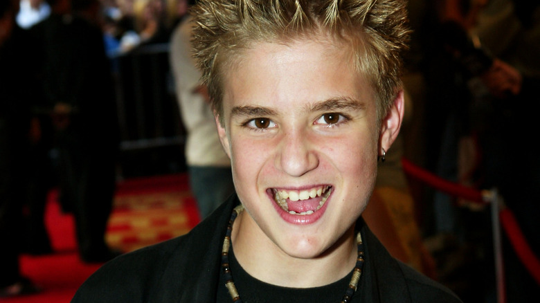 Kevin Clark smiles at a press event