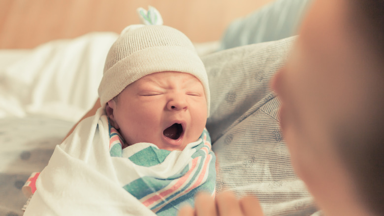 Close up of newborn yawning