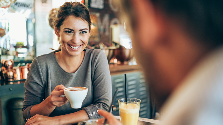 Attractive woman looking at man