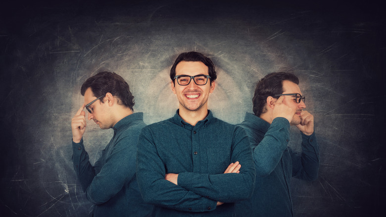 A man smiling facing forward framed by his own face in profile looking thoughtful and frustrated