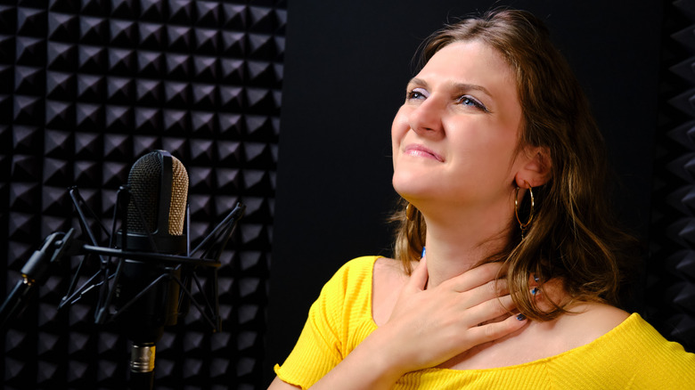 Woman touching throat