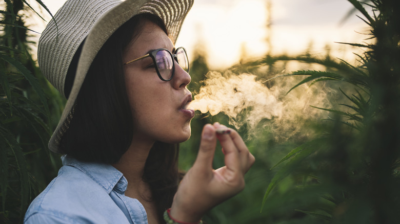 Woman smoking marijuana outdoors