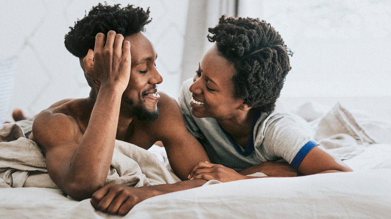 Couple happy in bed together