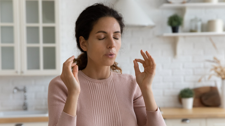 Woman breathing through stress