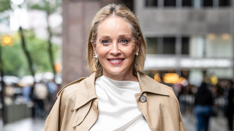 Sharon Stone in New York City smiling for a photograph outside