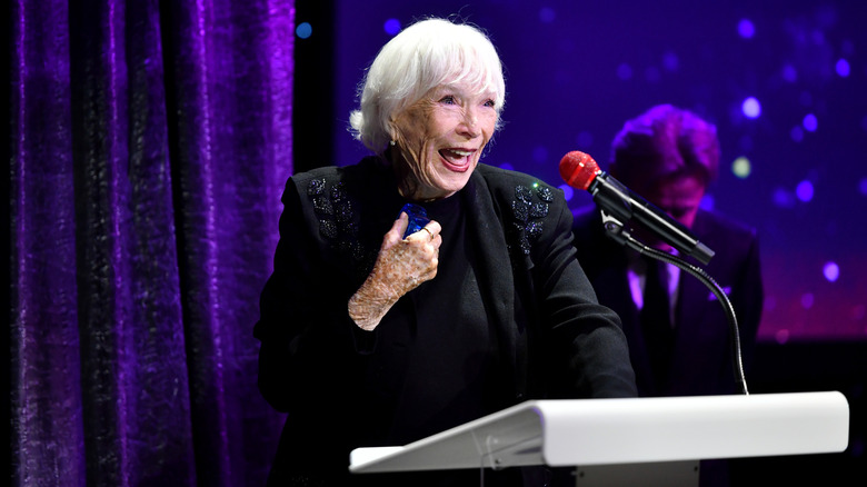 Shirley MacLaine accepting the Lifetime Achievement Award onstage