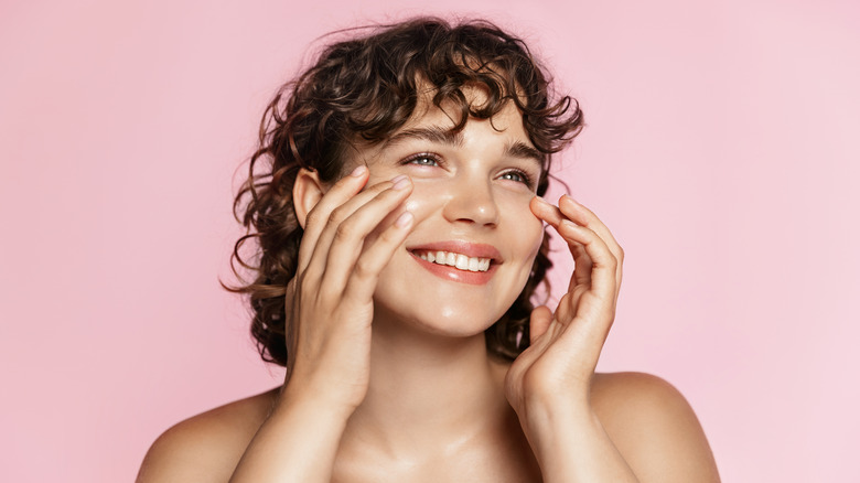 woman applying product on skin