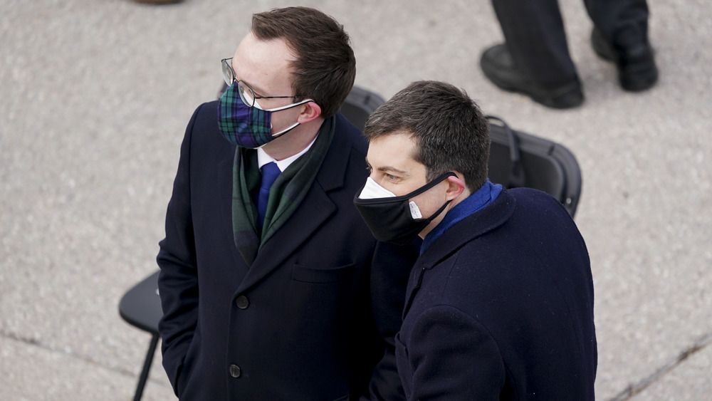 Former mayor Pete Buttigieg and husband Chasten Buttigieg wearing two masks at the inauguration