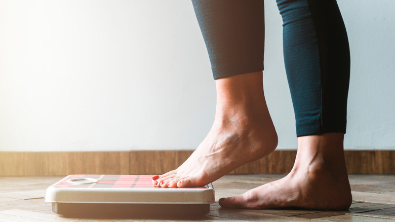 Feet stepping on scale