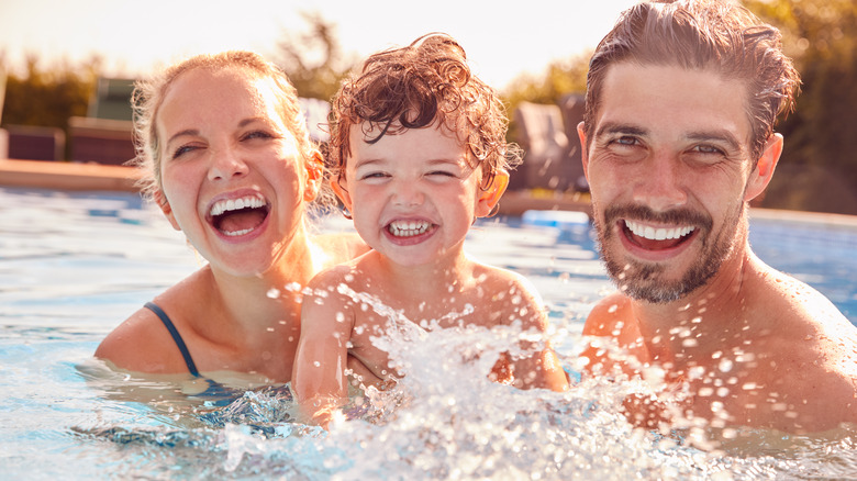 Parents and child in the pool