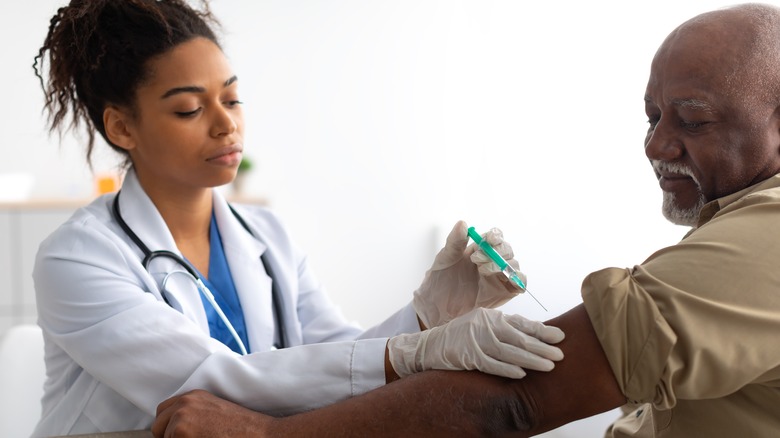 Older man receiving vaccine