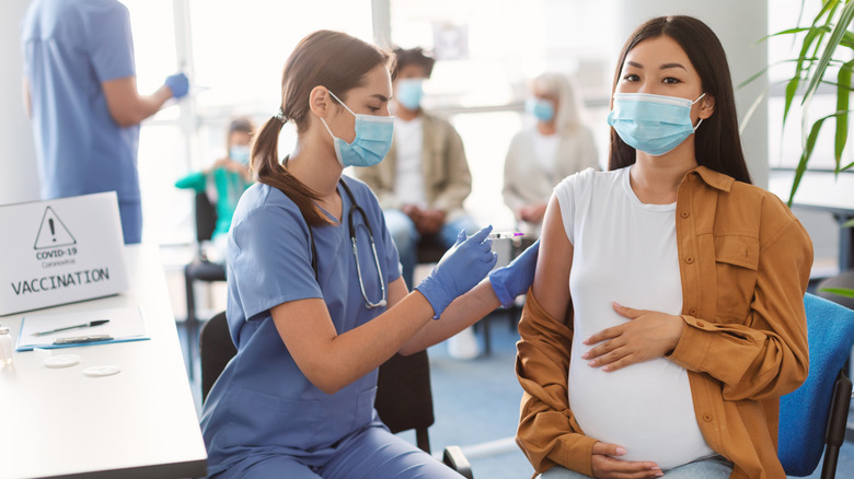A pregnant woman gets vaccinated