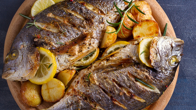 Roasted fish, potatoes, and lemon