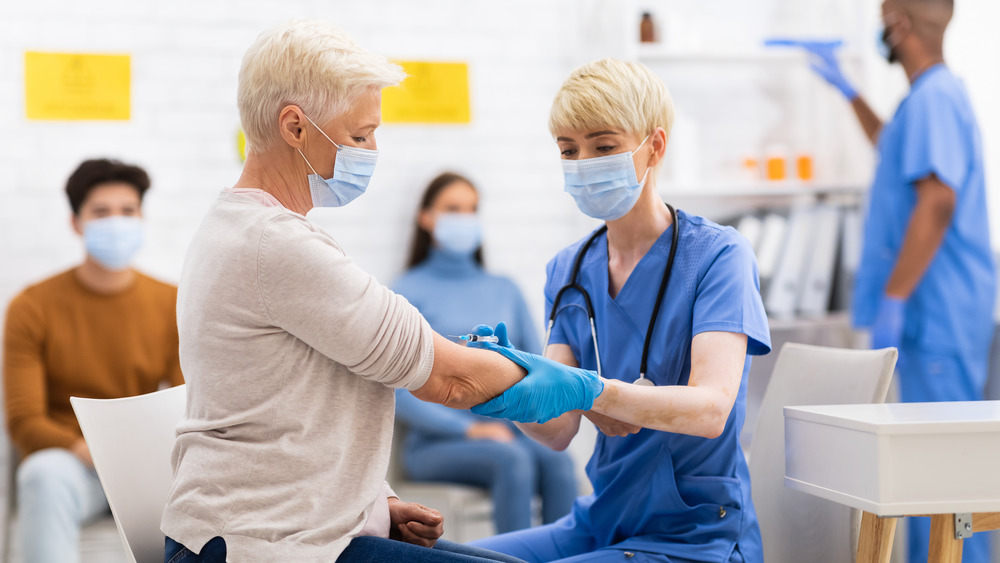 Woman getting COVID-19 vaccine
