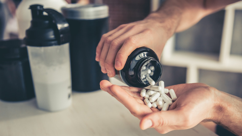 Man taking creatine supplements