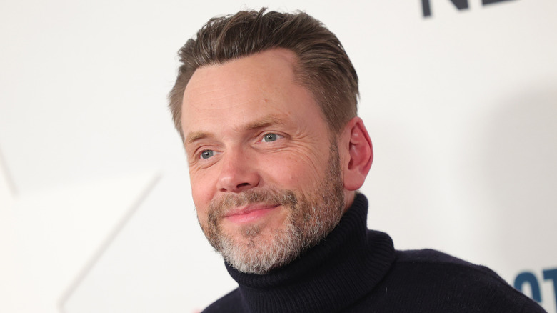 Joel McHale smiles at a 2026 event