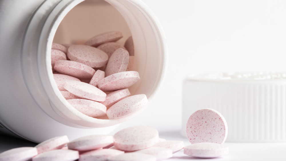 Melatonin pills being poured out of a bottle