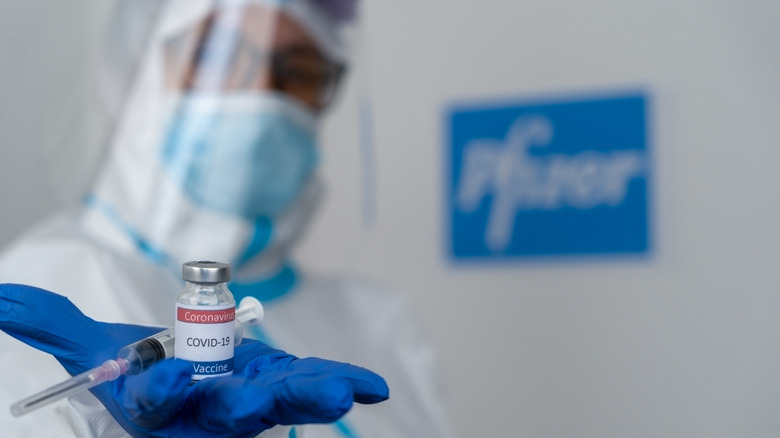 doctor holding covid-19 vaccine