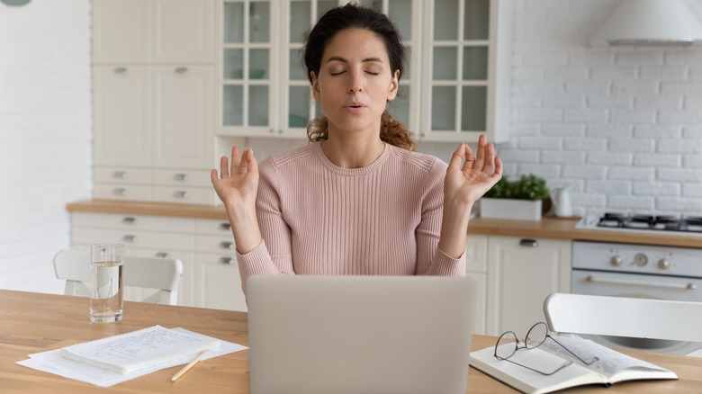 Woman with anxiety working on computer