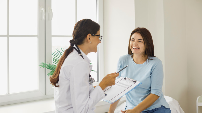 woman talking with doctor