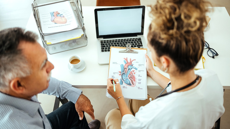 doctor explaining heart health to patient