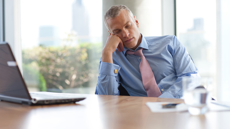 businessman sleeping at desk