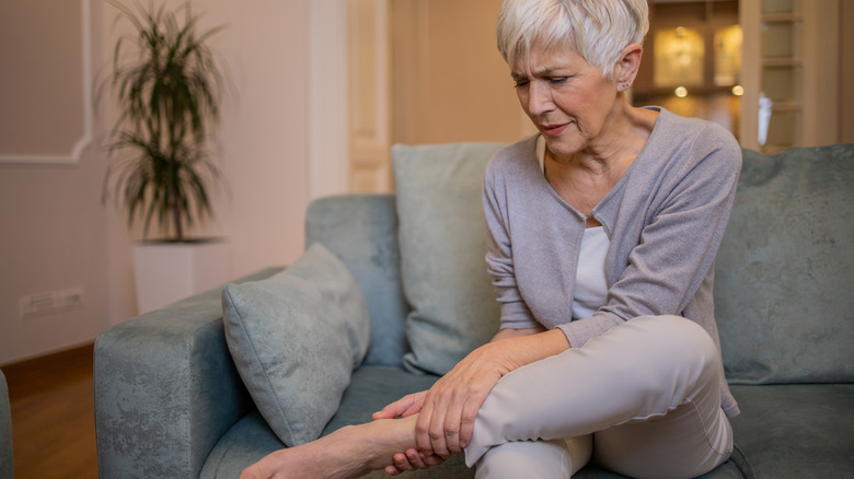 Woman with muscle cramp