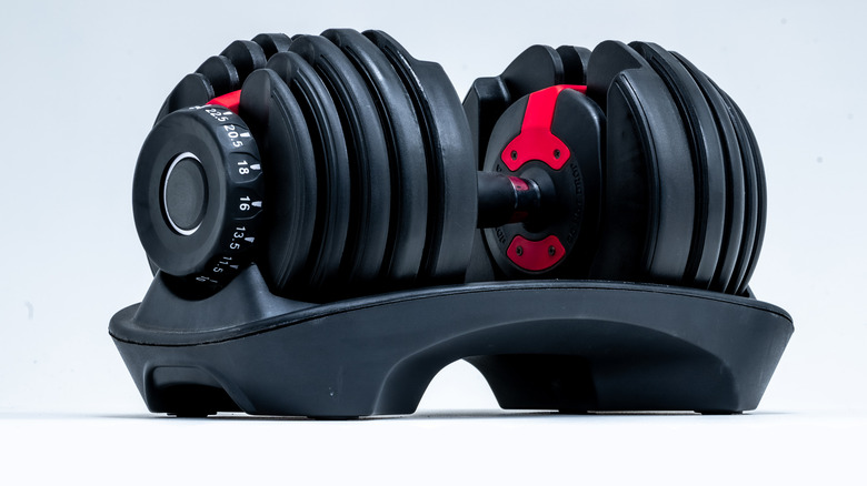 Adjustable dumbbell set on white floor