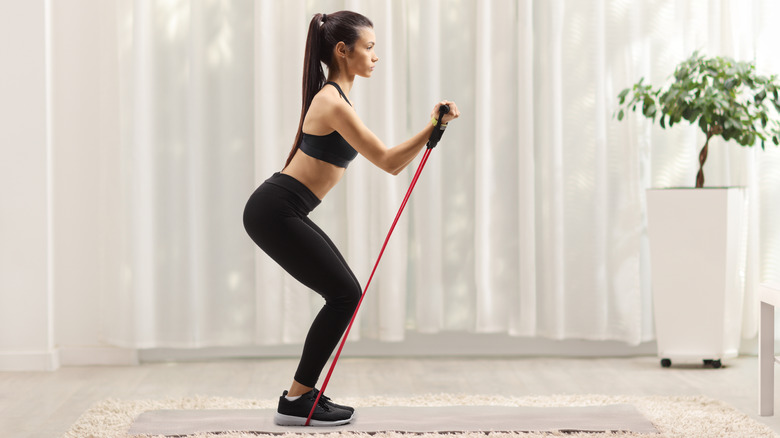 woman working out with resistance bands