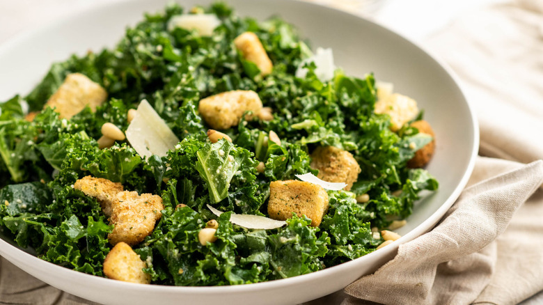 kale caesar salad in bowl