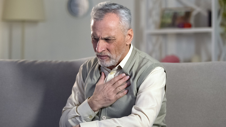 man experiencing trouble breathing