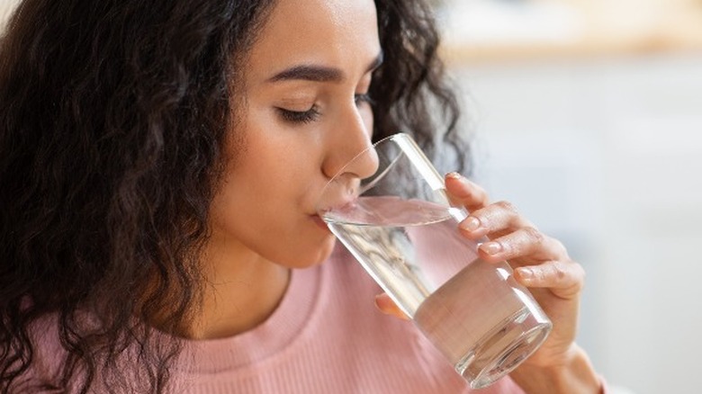 Young woman drinking water