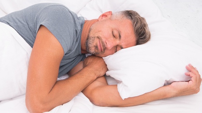 Man sleeping in bed