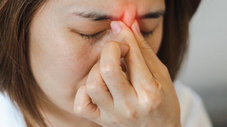 woman with painful sinus infection