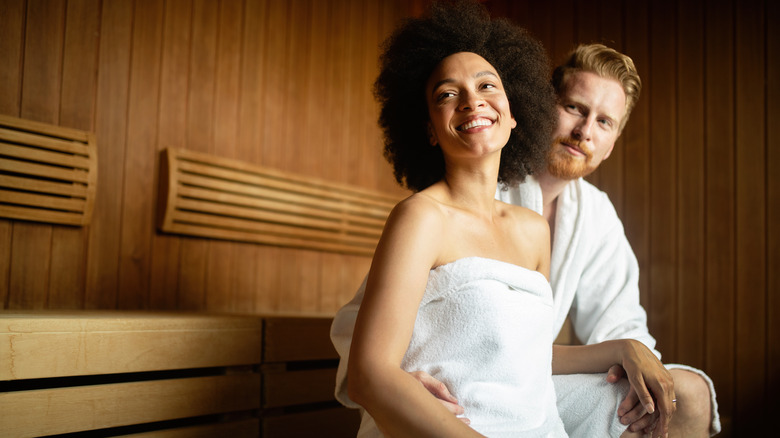 woman sauna drinking water
