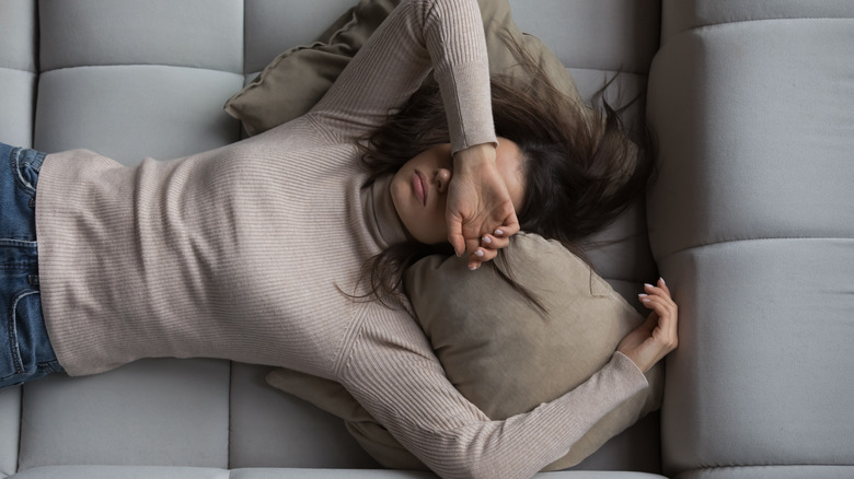 Woman sleeping on couch