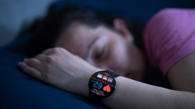 Sleeping person wearing smartwatch