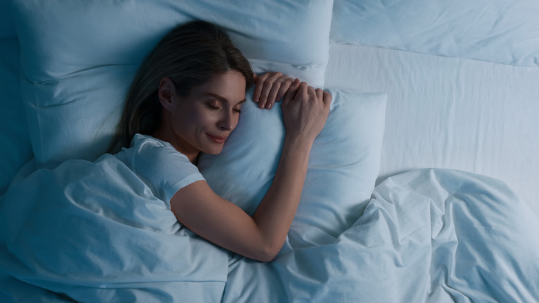 woman sleeping peacefully in bed