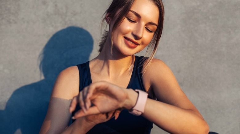 girl looking at a wearable device